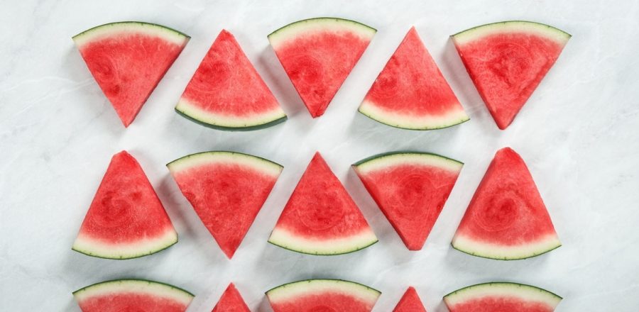 triangle shaped slices of watermelon, arranged in three rows of five